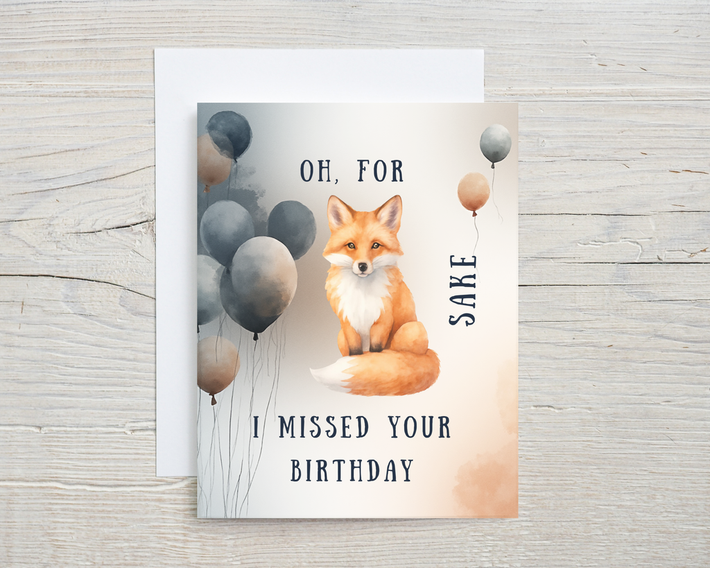Birthday card with a fox and balloons on a wooden surface with text "Oh for fox sake I missed your birthday"
