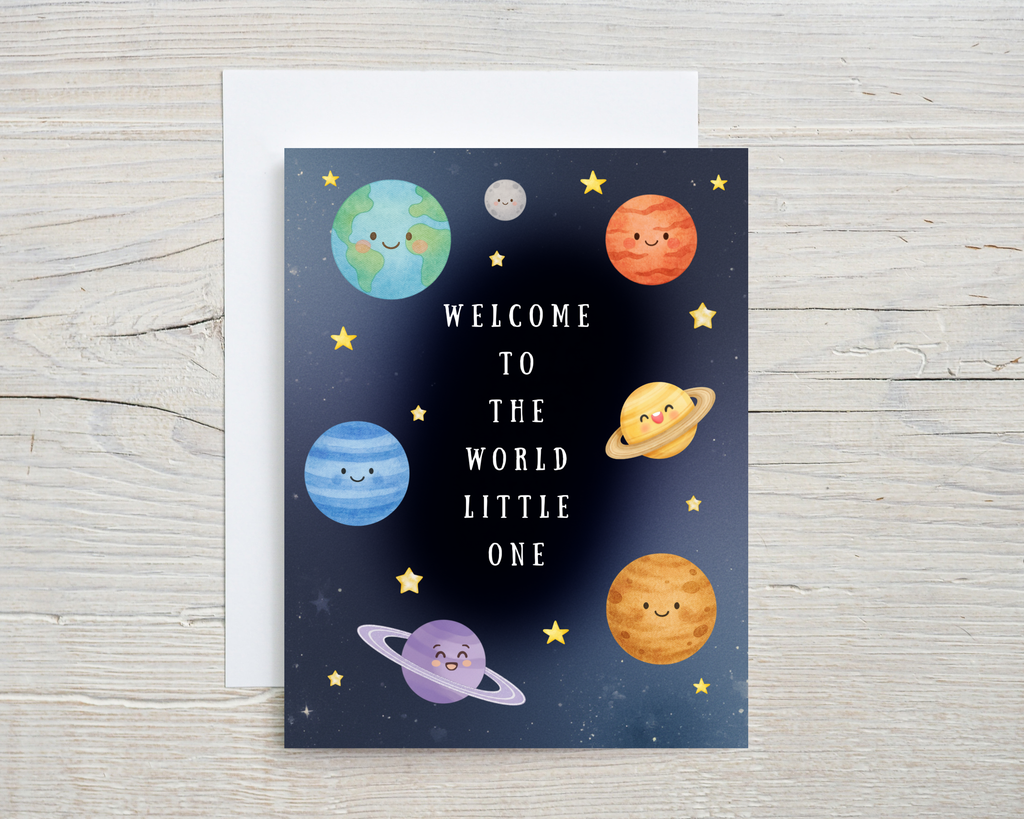 Greeting card with cartoon planets and stars on a wooden surface