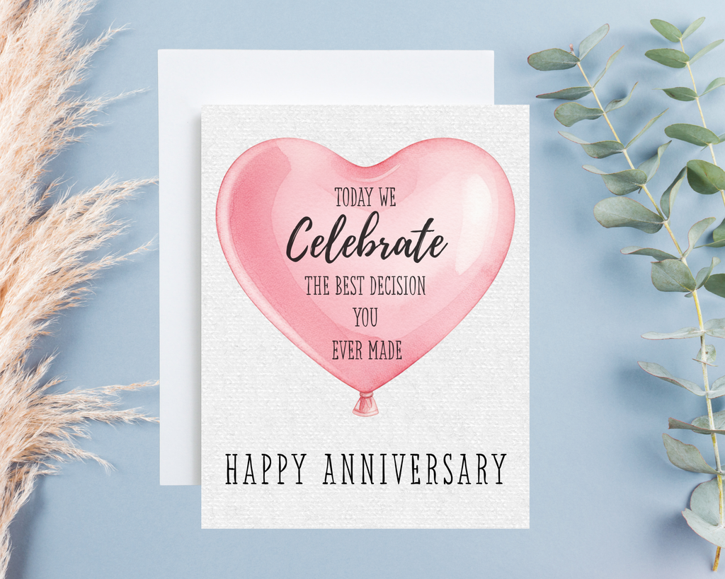 Anniversary card with pink heart balloon design on a light blue background
