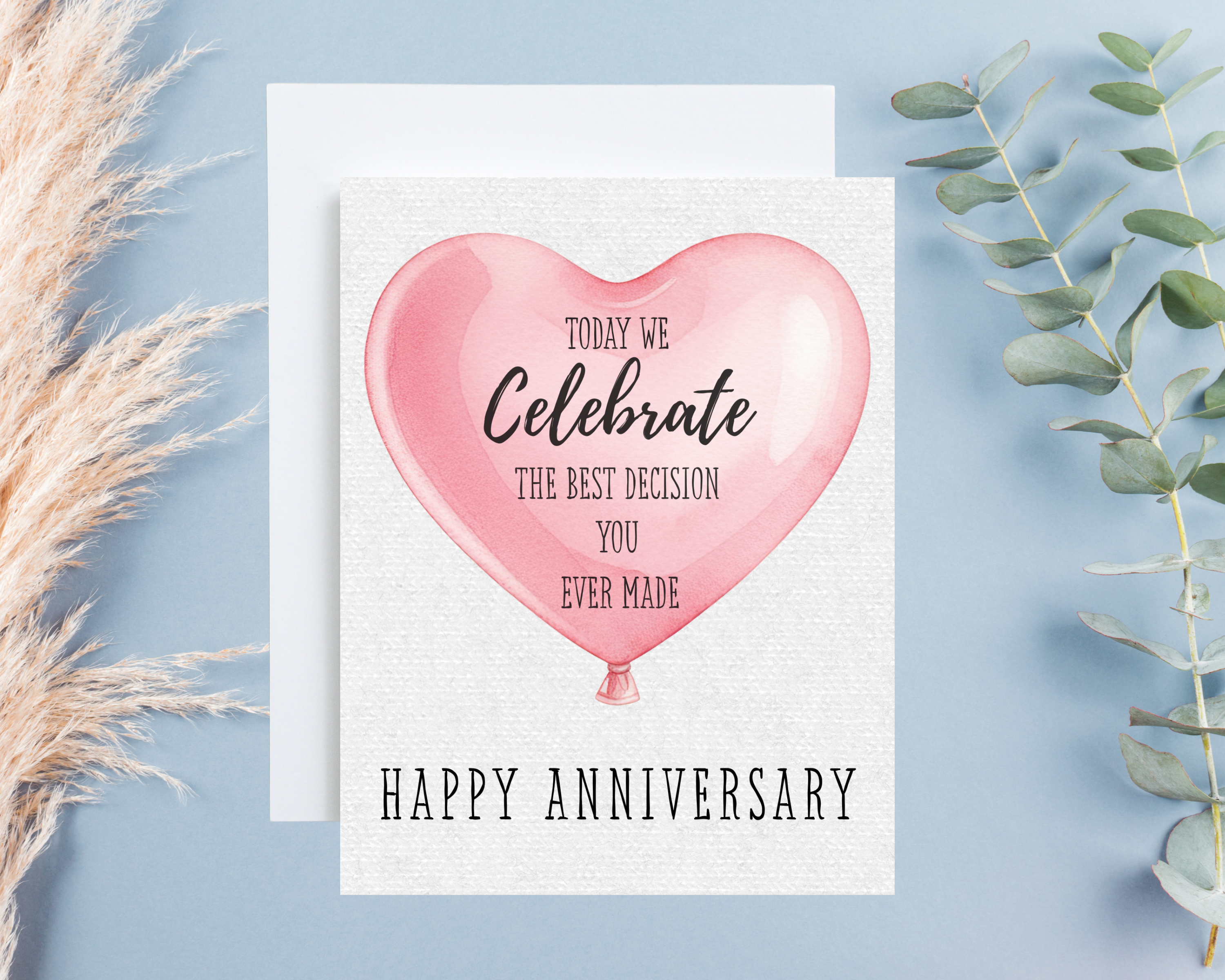 Anniversary card with pink heart balloon design on a light blue background
