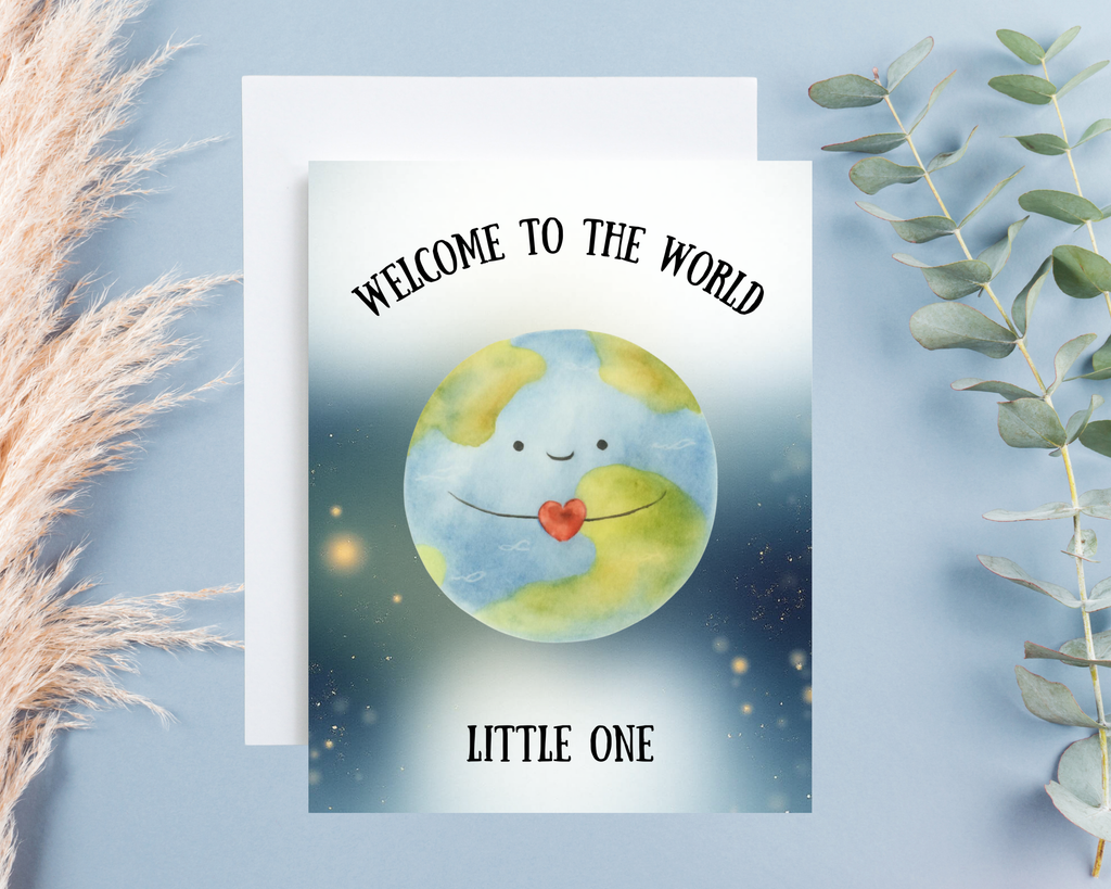 Greeting card with a smiling Earth and text 'Welcome to the World, Little One' on a light blue background.