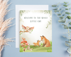 Greeting card with fox and baby fox illustration on a light blue background