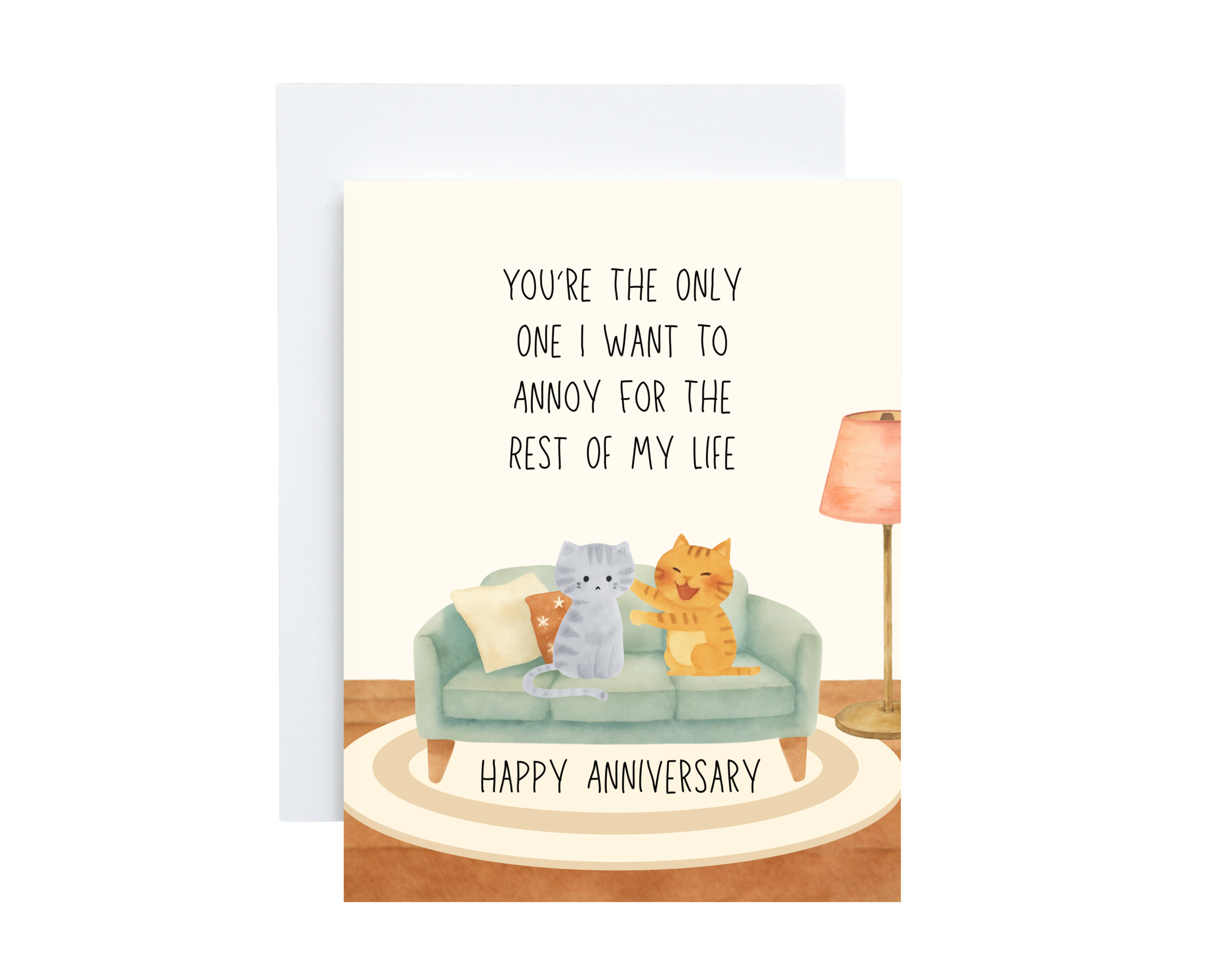 Card with cartoon cats on a couch and humorous text, suitable for an anniversary gift.