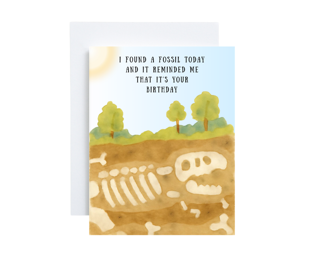 Birthday card with fossil illustration and humorous text on a white background